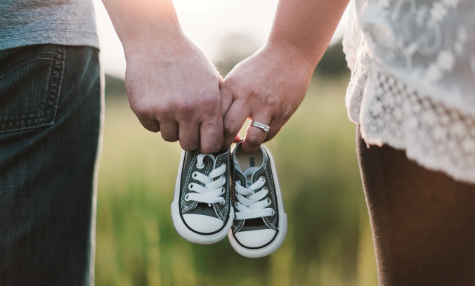 Couple with Baby Shoes